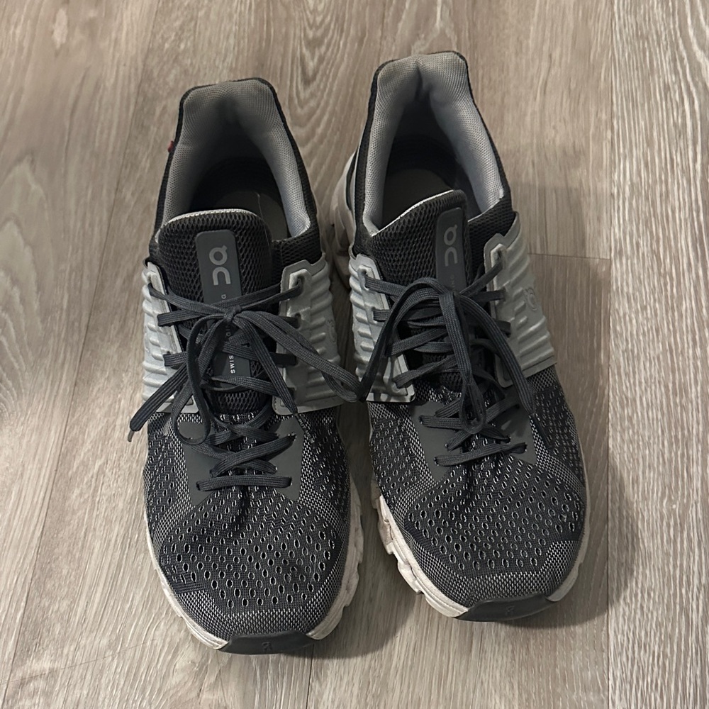 Black and Gray Athletic On clouds